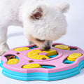 Dog using a pink and blue puzzle slow-feeder bowl